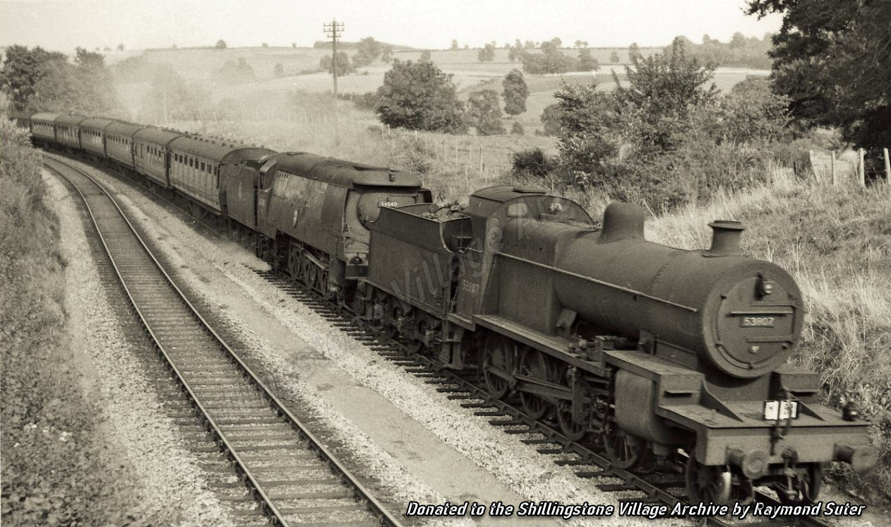 c1955: Pines Express pulled by Battle Of Britain class engine 'Crewkerne' in a doubleheader with a 7F Fowler